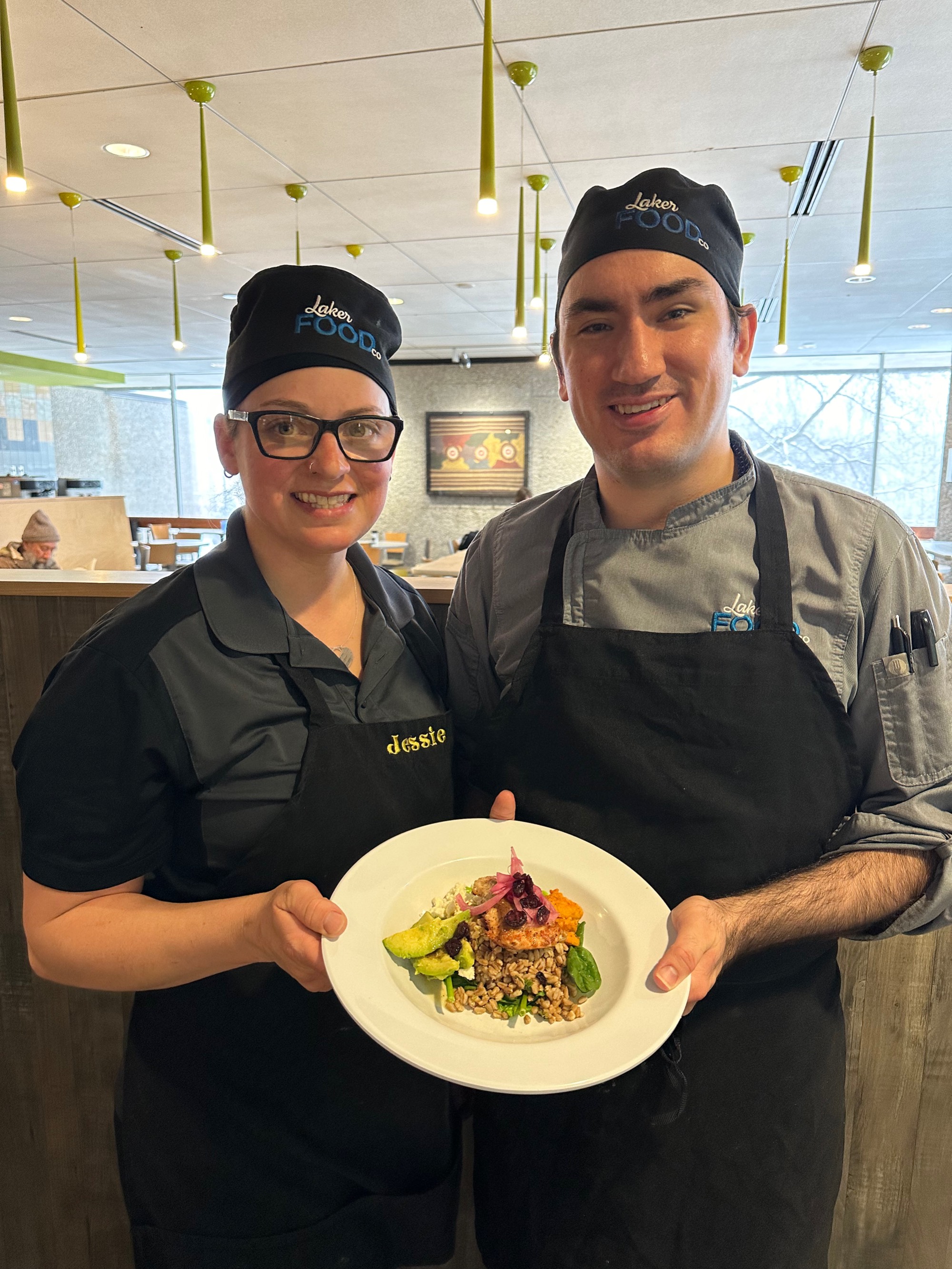 A student cutting up green apples.